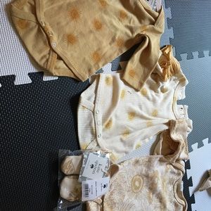 Three rompers, Kate Quinn new with tags size 3-6 months.